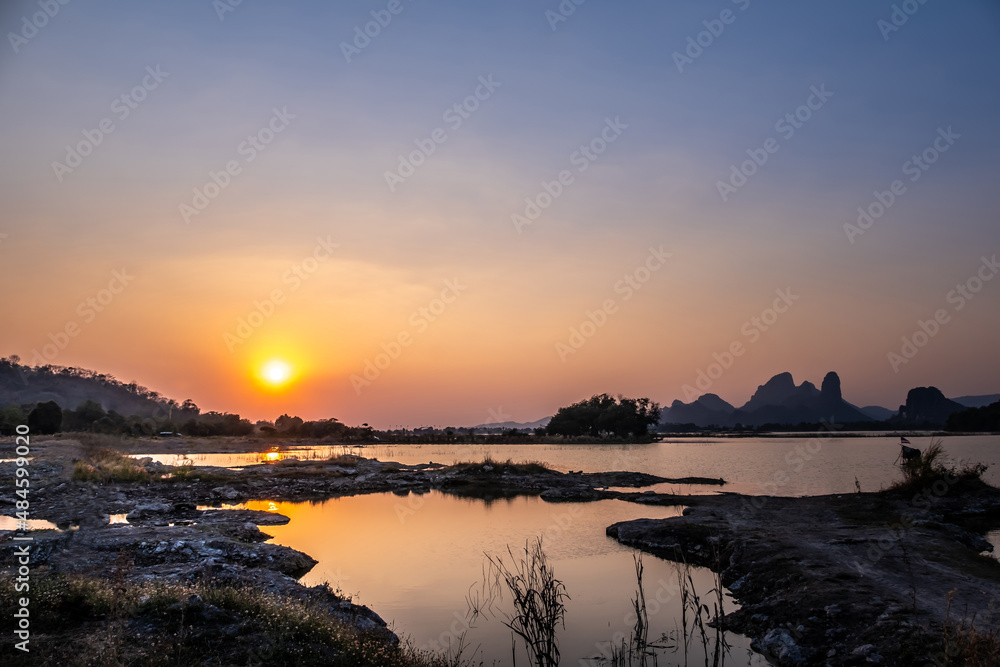 Evening light at Sab Lek Reservoir. A reservoir popular for fishing, sailing, birdwatching, with sunset views of Sab Lek Reservoir in Lopburi province, Thailand