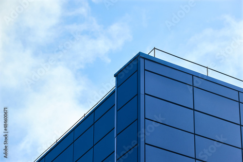 Aluminum composite panels for repair restore facade of commercial building blue corner construction with lightning protection system outdoor wide angle with copyspace conceptual minimalism.