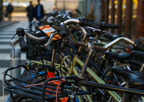 Bicycles parked on a street in Copenhagen. Shallow depth of field.