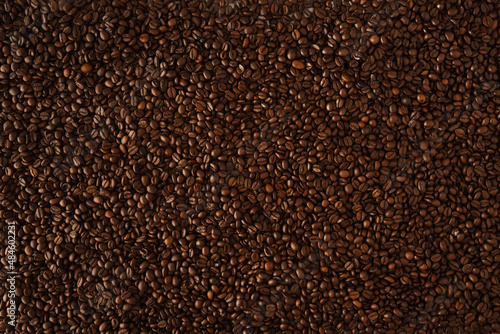 Background with heap of natural dry coffee beans