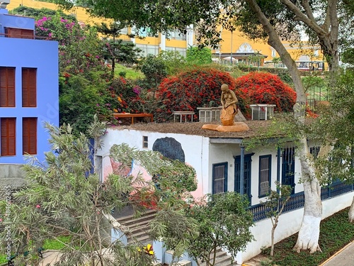 Peru Lima city beautiful cityscape. Scenic street in Barranco district of Peru town. Flowering park by Peruvian capital. photo