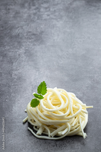 Chechil soft cheese on gray stone background