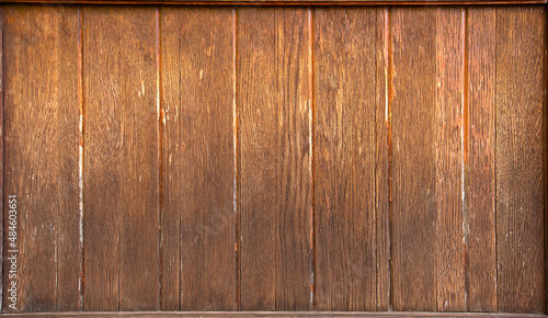 Old yellow wooden wall, aged in the rain and sun.