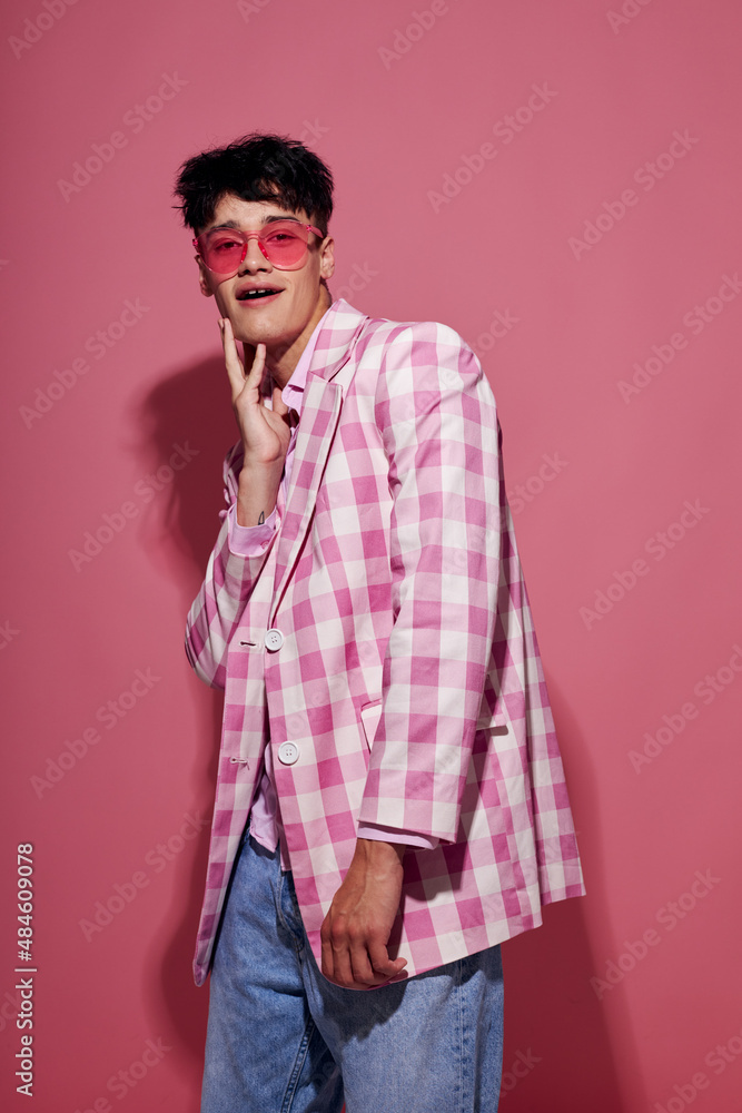 portrait of a young man self confidence pink plaid blazer fashion posing pink background unaltered portrait of a young man self confidence pink plaid blazer fashion posing pink background unaltered