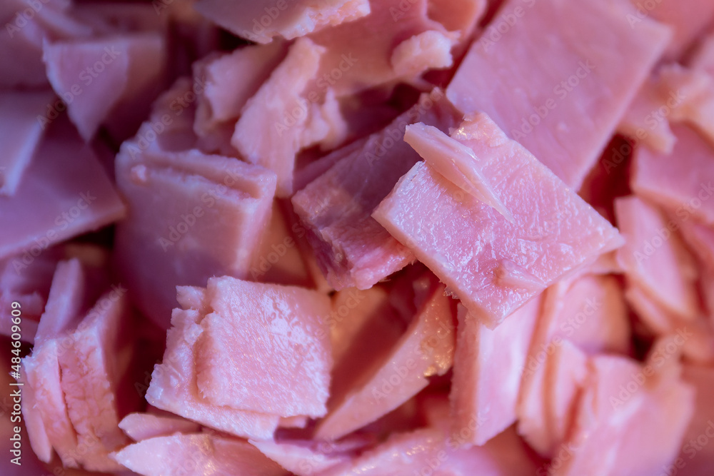 Closeup background texture of diced smoked ham Closeup background texture of diced smoked ham