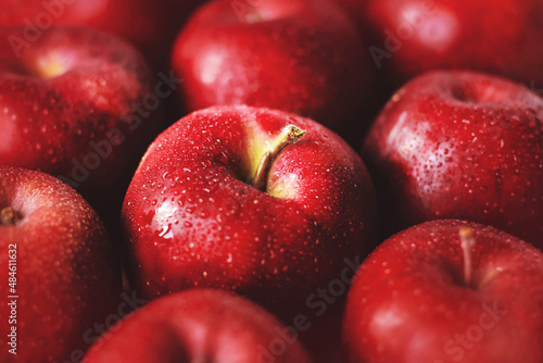 Large red ripe delicious apples in the grocery store. Fruit harvest. Proper nutrition. Vegetarian diet. photo