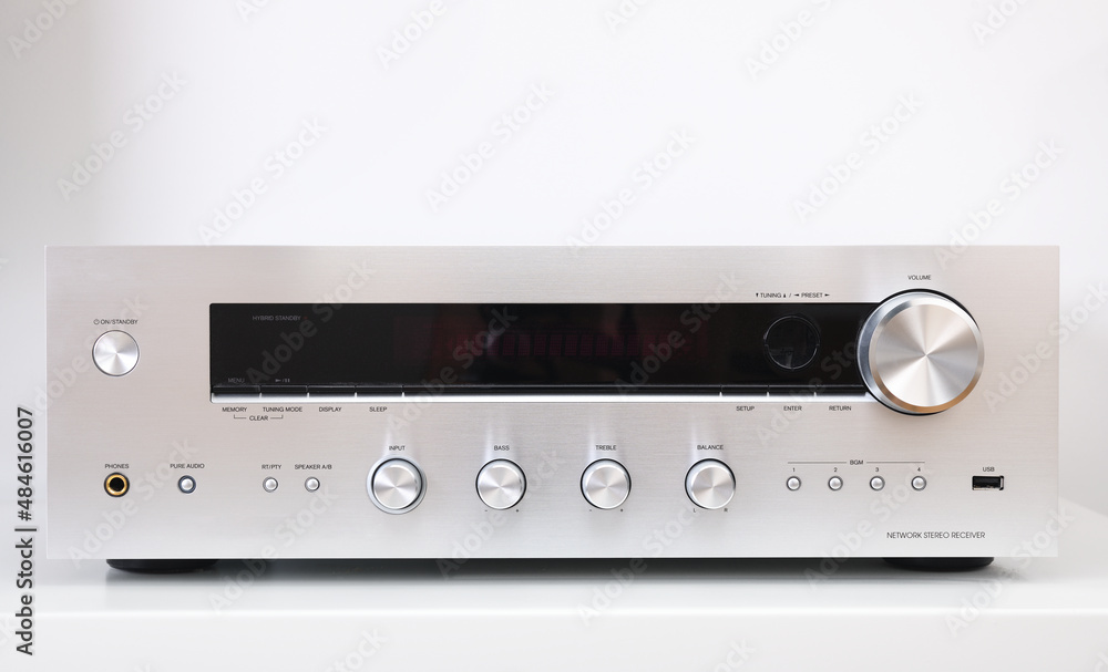 Front shot of silver music receiver isolated on white background.Radio stereo receiver. Front shot of silver music receiver isolated on white background.Radio stereo receiver.