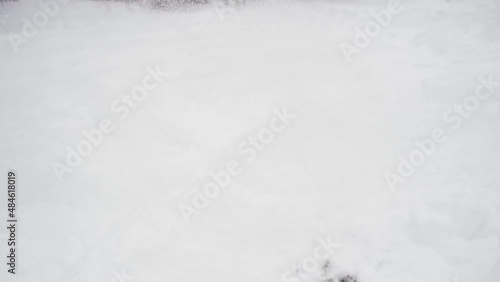 Wallpaper Mural Close-up, slow motion. A snowbike pulls away and the snow flies in different directions. Winter vehicle.  Torontodigital.ca