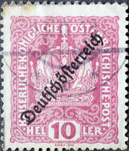 Austria - circa 1918: a postage stamp from Austria, showing the crown of Austria with overprint 