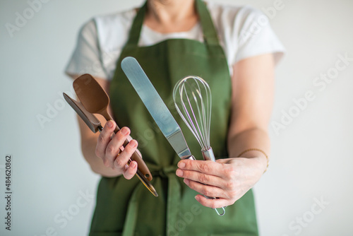 pastry chef with cake and baking tools