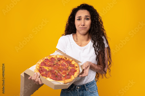 Sad Young Lady Posing With Italian Pizza