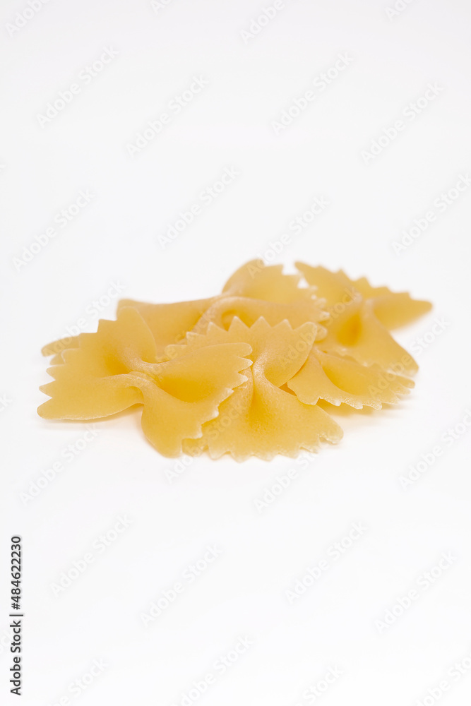 Tasty uncooked pasta on white background. Tasty uncooked pasta on white background.