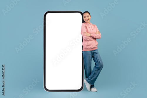 Full screen shot of korean woman posing with big cellphone