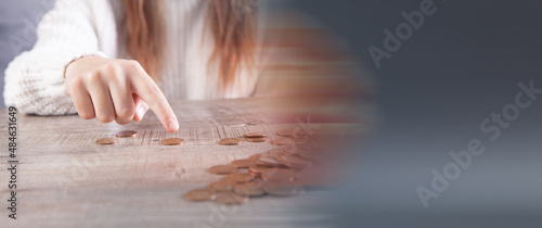 Wallpaper Mural woman counting coins on the table Torontodigital.ca