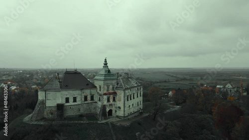 aerial view drone flight around of Old fairytale castle on the hill in Ukraine. Olesko Castle from above, Lviv district, Ukraine. Aerial video. Fortification sights of Ukraine photo