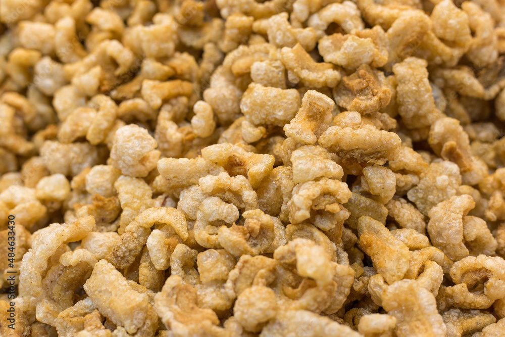 Pork crackling (pork snack, pork scratching) is fried pork skin as snack and we can eat it with noodles in Thai food style. Pork crackling (pork snack, pork scratching) is fried pork skin as snack and we can eat it with noodles in Thai food style.