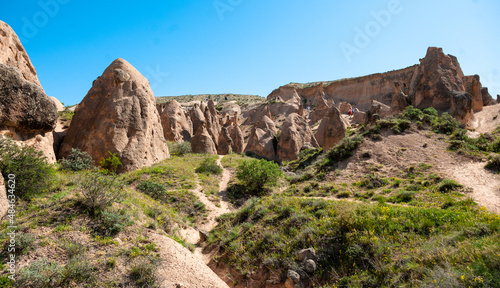 Goreme landscape from Cappadocia area in Turkey during a sunny summer day with blue sky and white clouds