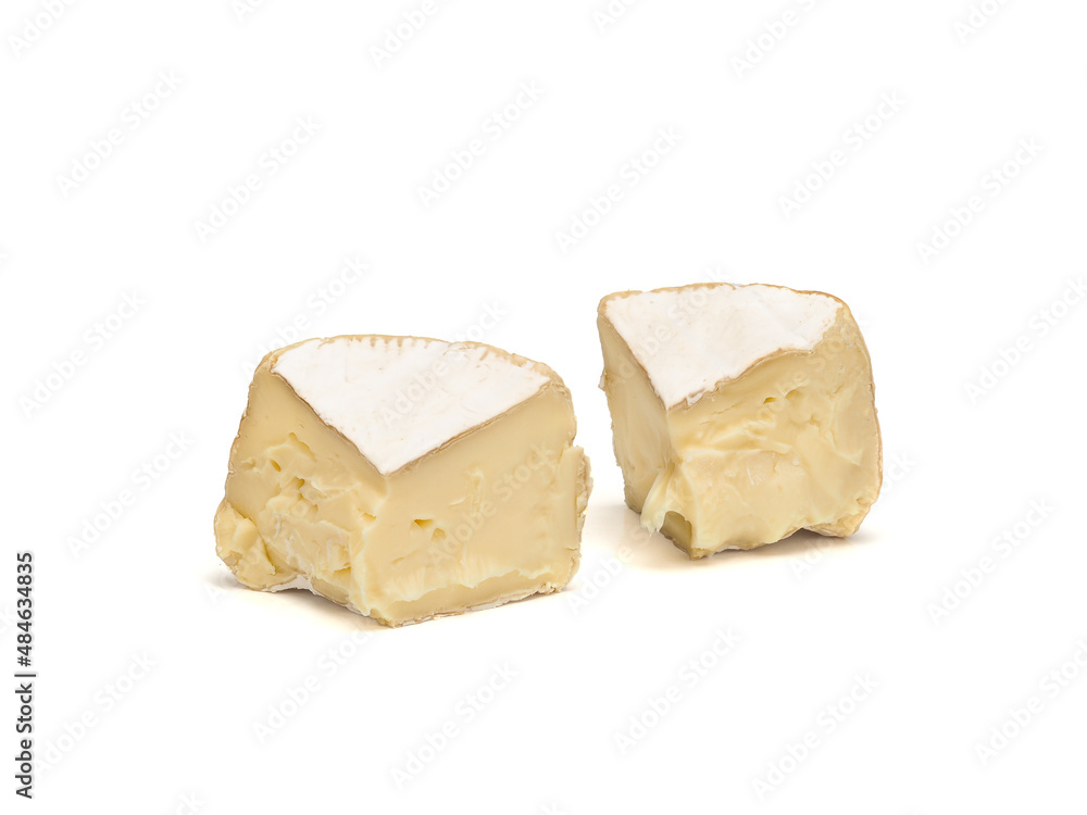 two pieces of fresh brie cheese isolated on white background