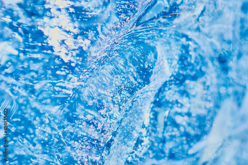 Texture background of pure natural water concept. Selective focus. Wave, whirlpool and splash.