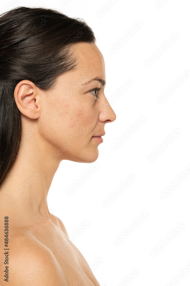 Profile, side view portrait of a beautiful woman without makeup on a white Profile, side view portrait of a beautiful woman without makeup on a white