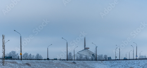 Panorama of the highway in winter. In the background is the memorial complex Mound of Glory.