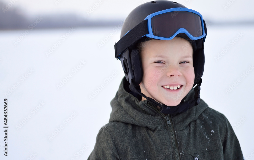 Close-up of smiling boy wearing ski mask in winter Close-up of smiling boy wearing ski mask in winter
