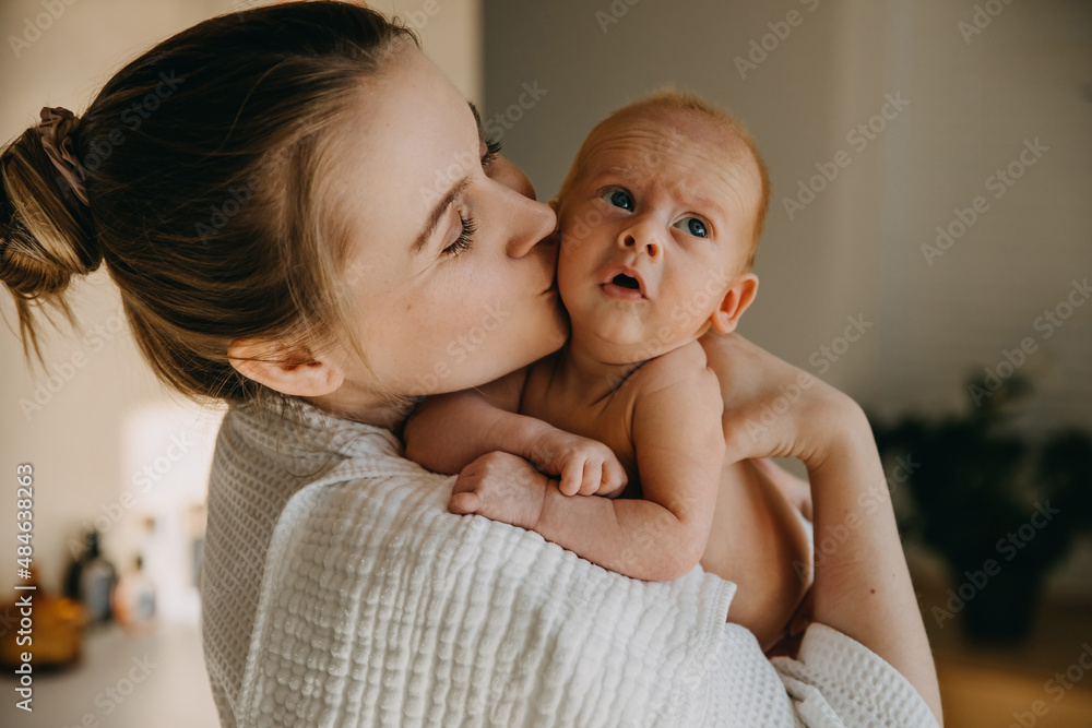 Mother Kissing One Month Old Baby On Cheek Stock Photo Adobe Stock