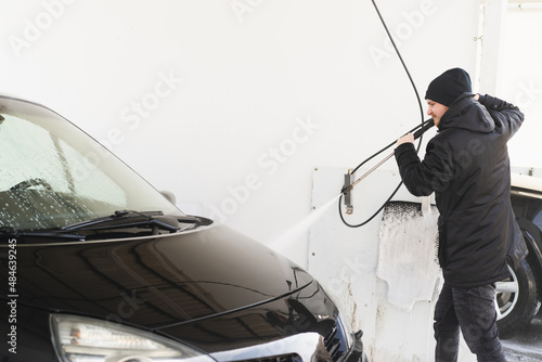  Car cleaning service. The man washing his car on self-service car. Express Car Wash © Анастасія Стягайло