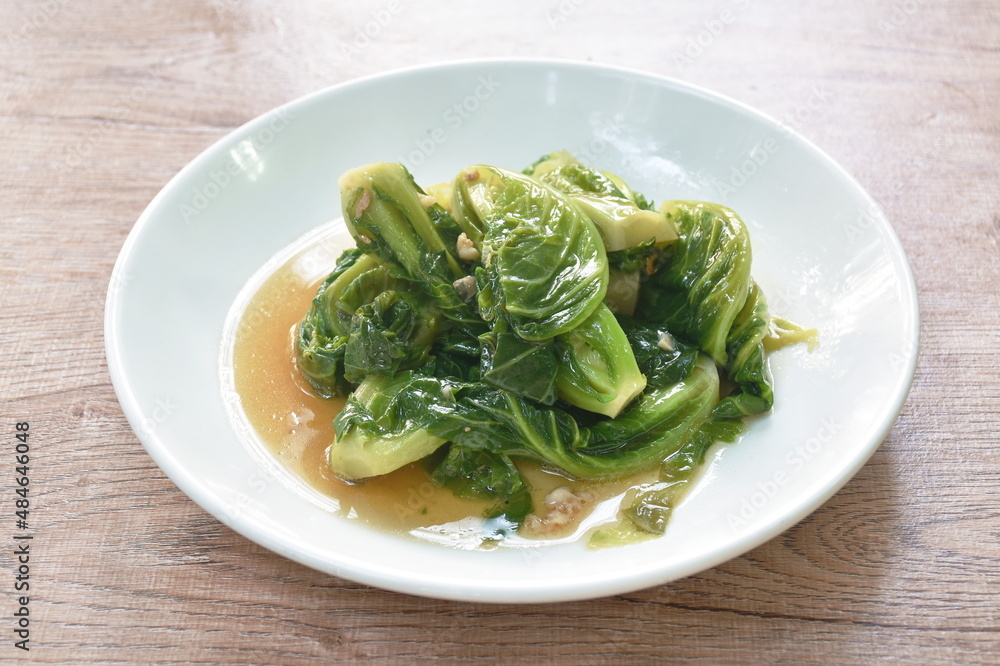 fried Brussels sprout in oyster sauce on plate