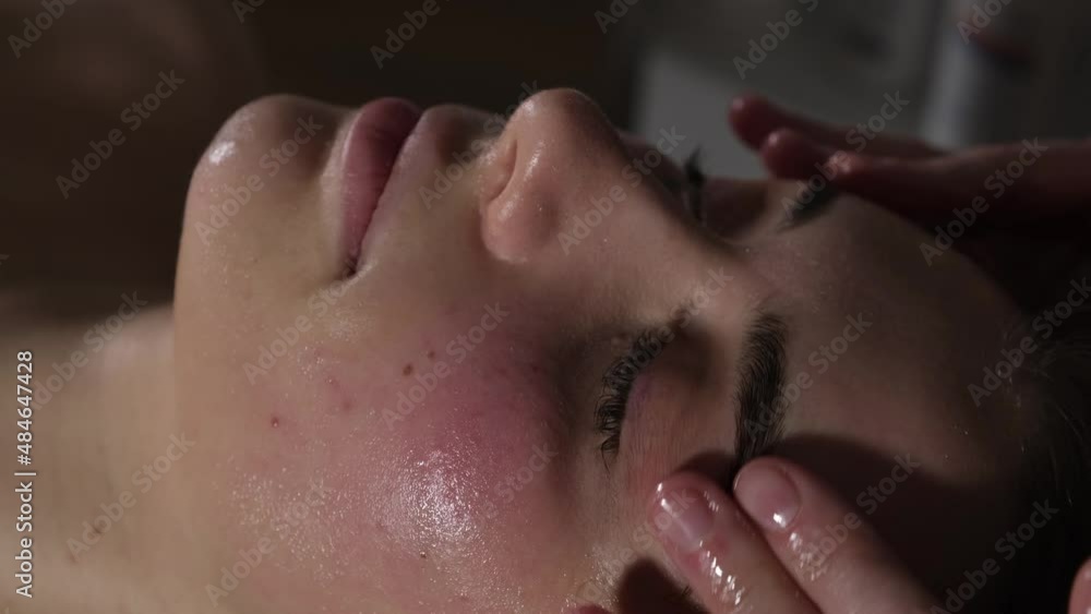 acupressure massage of a woman's face acupressure massage of a woman's face