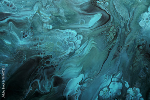 Fluid Art. Metallic Green and blue abstract waves with golden particles on black background. Marble effect background or texture