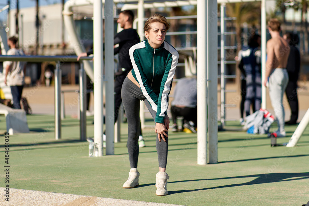 woman doing exercise at an outdoor gym woman doing exercise at an outdoor gym