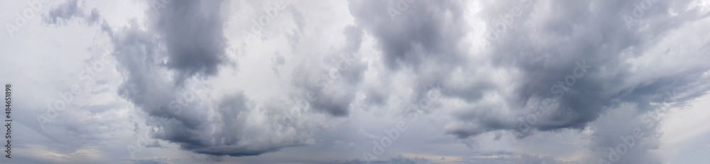 Ponoramic cloudy sky background. Gray clouds on sky Ponoramic cloudy sky background. Gray clouds on sky