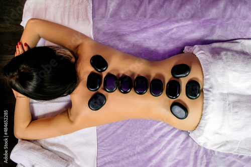 Spa treatments with stones on a girl horizontal