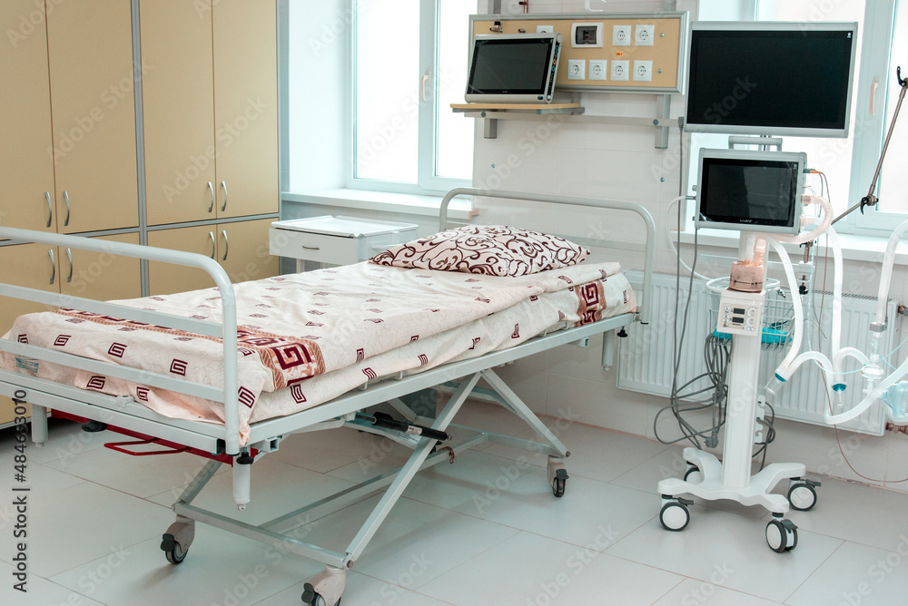 Bed in the intensive care unit and equipment in a modern hospital.