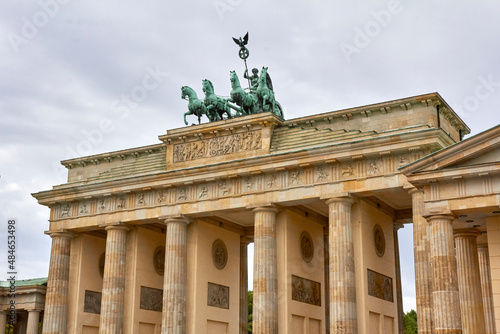 Berlin  Germany  August 18  2021. Brandenburg Gate with statue and cloudy sky in the background.