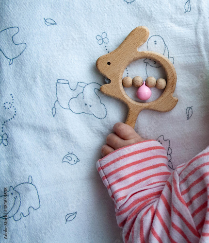 A child's hand with a toy. A close plan. Family photo shoots. Creative photo.