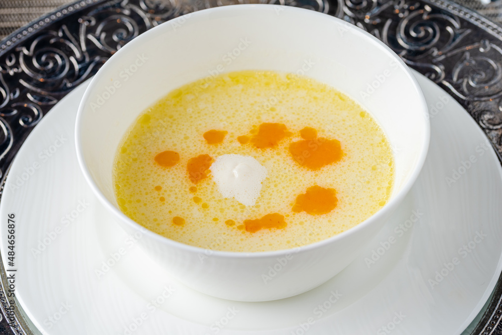 Seasoned fish soup on a white porcelain plate Seasoned fish soup on a white porcelain plate