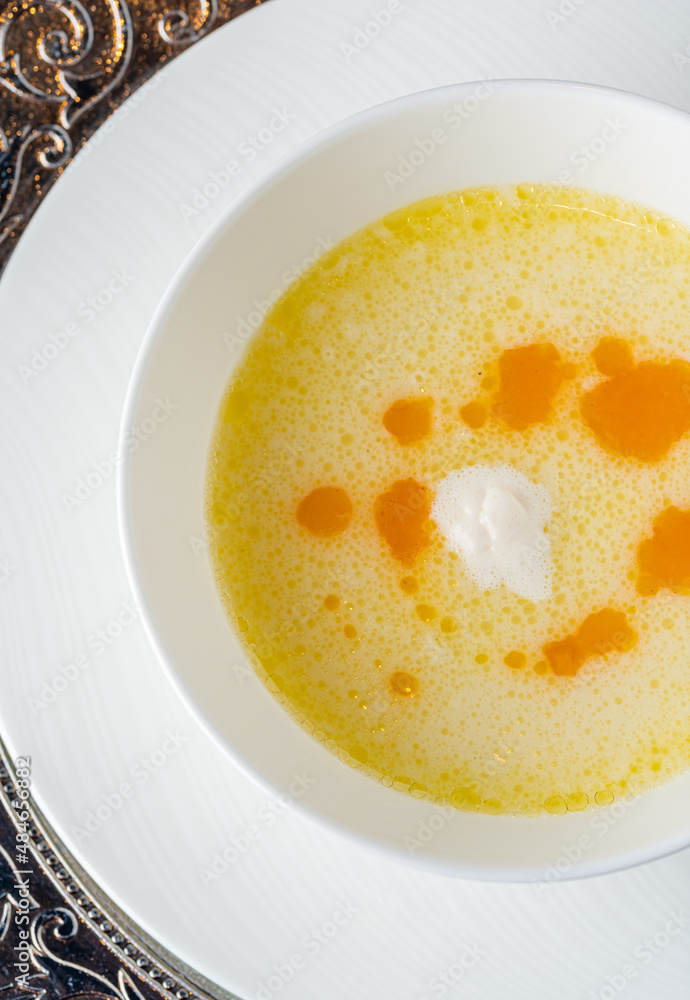 Seasoned fish soup on a white porcelain plate Seasoned fish soup on a white porcelain plate