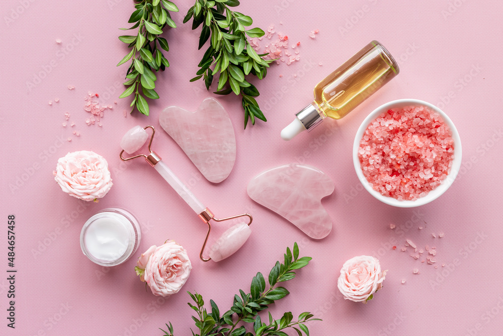 Cosmetics products with gua sha face massage stone and roller Cosmetics products with gua sha face massage stone and roller