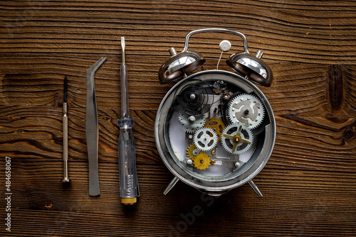 Open alarm clock with watch mechanism - steel gears and wheels closeup