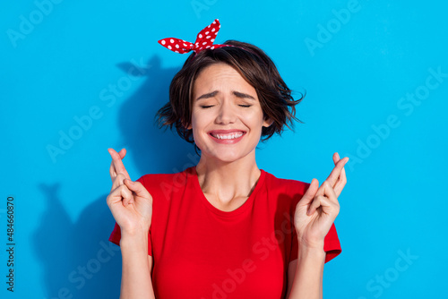 Valokuva Photo of optimistic millennial brunette lady crossed fingers wear red t-shirt ha
