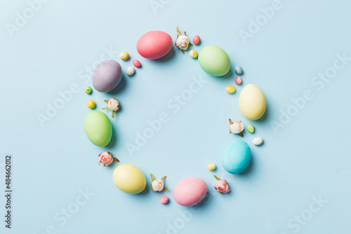 round frame Multi colors Easter eggs on colored background . Pastel color Easter eggs holiday concept with empty space for you design