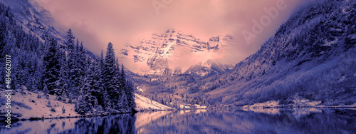Aspen Maroon bells mountain range in Colorado winter snow covered weather in the National Park   photo