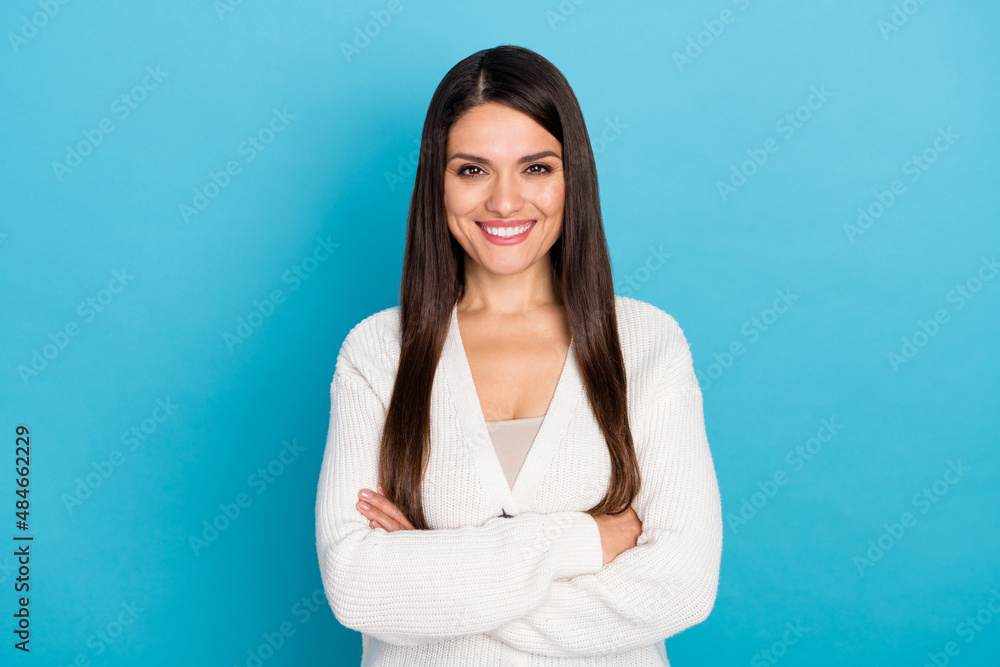 Photo of mature smart lady crossed palms wear white sweater isolated on blue color background