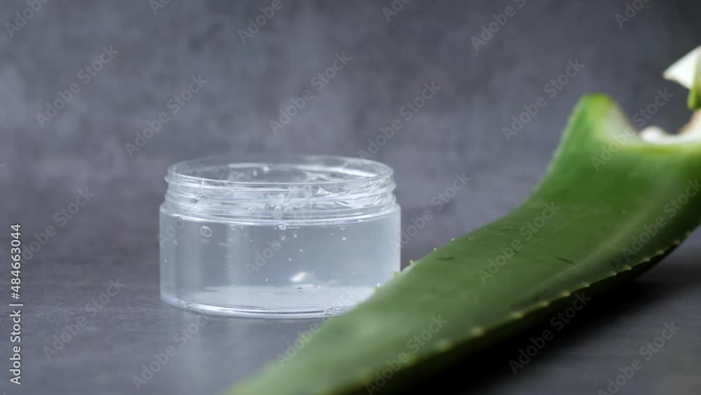 Fresh aloe vera sliced and liquid gel in plastic container on white background Fresh aloe vera sliced and liquid gel in plastic container on white background