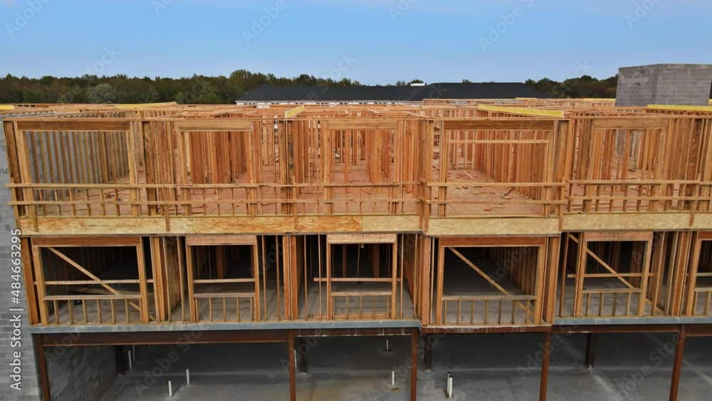 Aerial top view the a new house under construction wood framing beams Aerial top view the a new house under construction wood framing beams