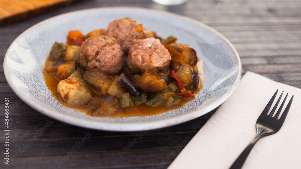 steamed meatballs with stewed vegetables with haze on plate steamed meatballs with stewed vegetables with haze on plate