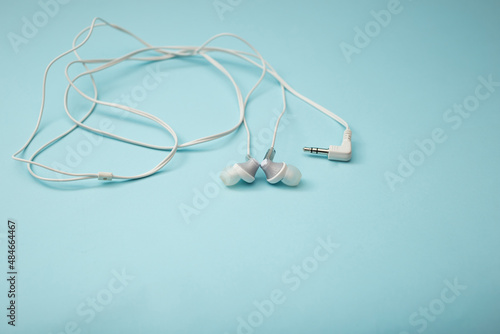 Headphones for gadget on background