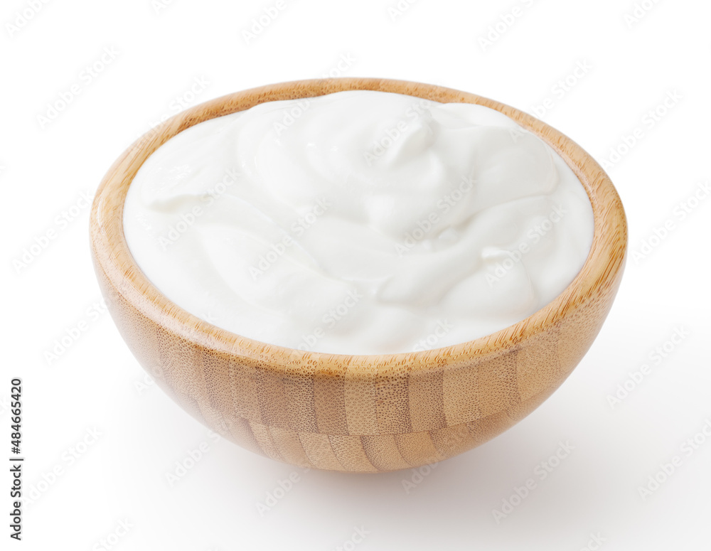 Sour cream in wooden bowl isolated on white background with clipping path Sour cream in wooden bowl isolated on white background with clipping path